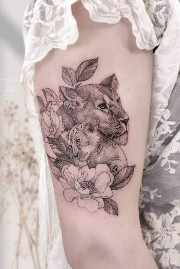 Mother and baby lion tattoo by @marika_ink