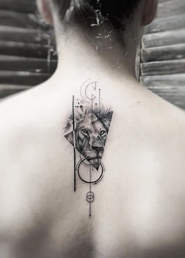 Geometric lion back tattoo by @p.art_tattoo