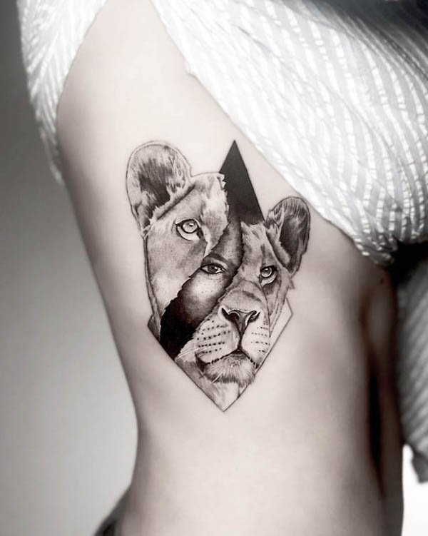 Peer through the mask lion tattoo by @rbn_says