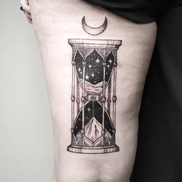 A gorgeous blackwork sandglass tattoo by @melencolia.tattoo- Fantasy Magic tattoos