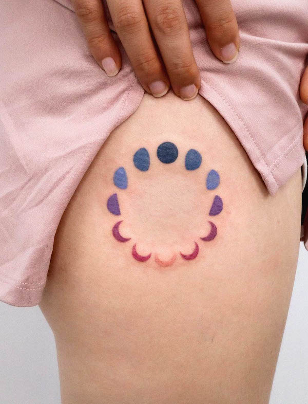 Rainbow color moon phase thigh tattoo by @tattooist_sigak