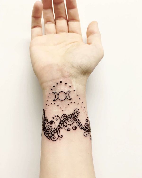 A detailed Triple Moon wrist tattoo by @relaxandpain - Wicca symbol tattoos