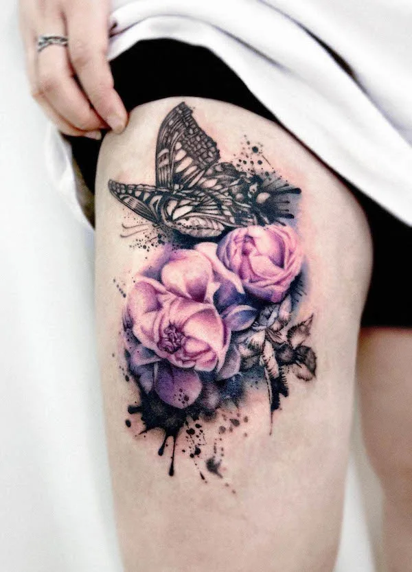 Realism rose and butterfly thigh tattoo by @gooka.tattoo