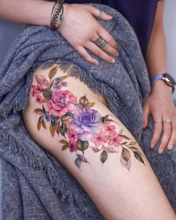 Beautiful flowers thigh tattoo by @tattooist_silo