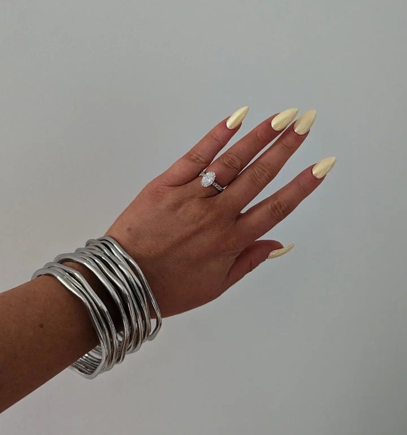 How to rock yellow chrome nails, spring's most cheerful manicure trend.