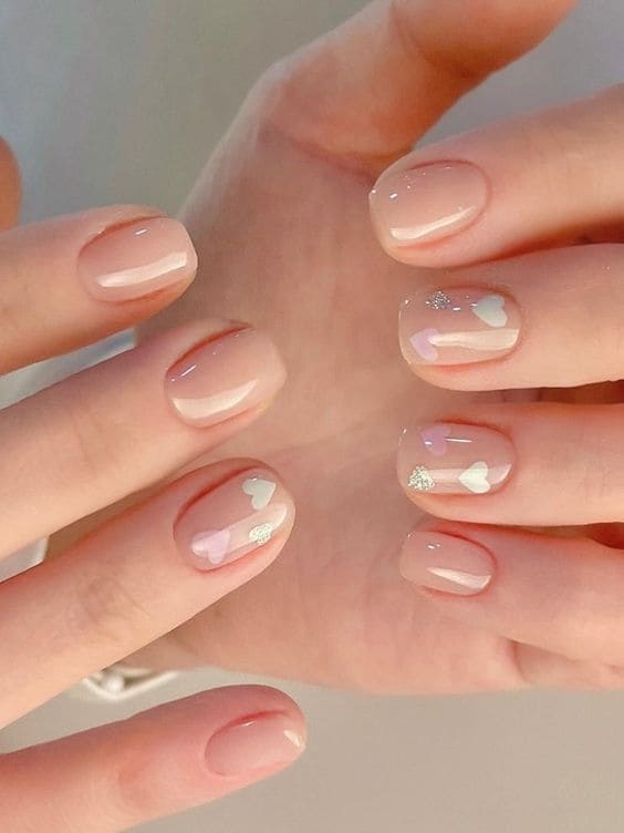 Korean Valentine's Day nail designs: nude shade with hearts