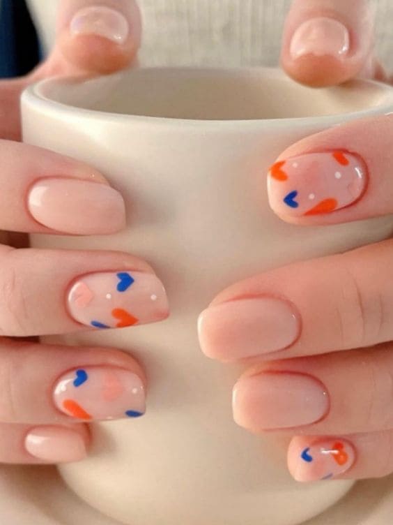 Korean Valentine's Day nail designs: nude shade with hearts