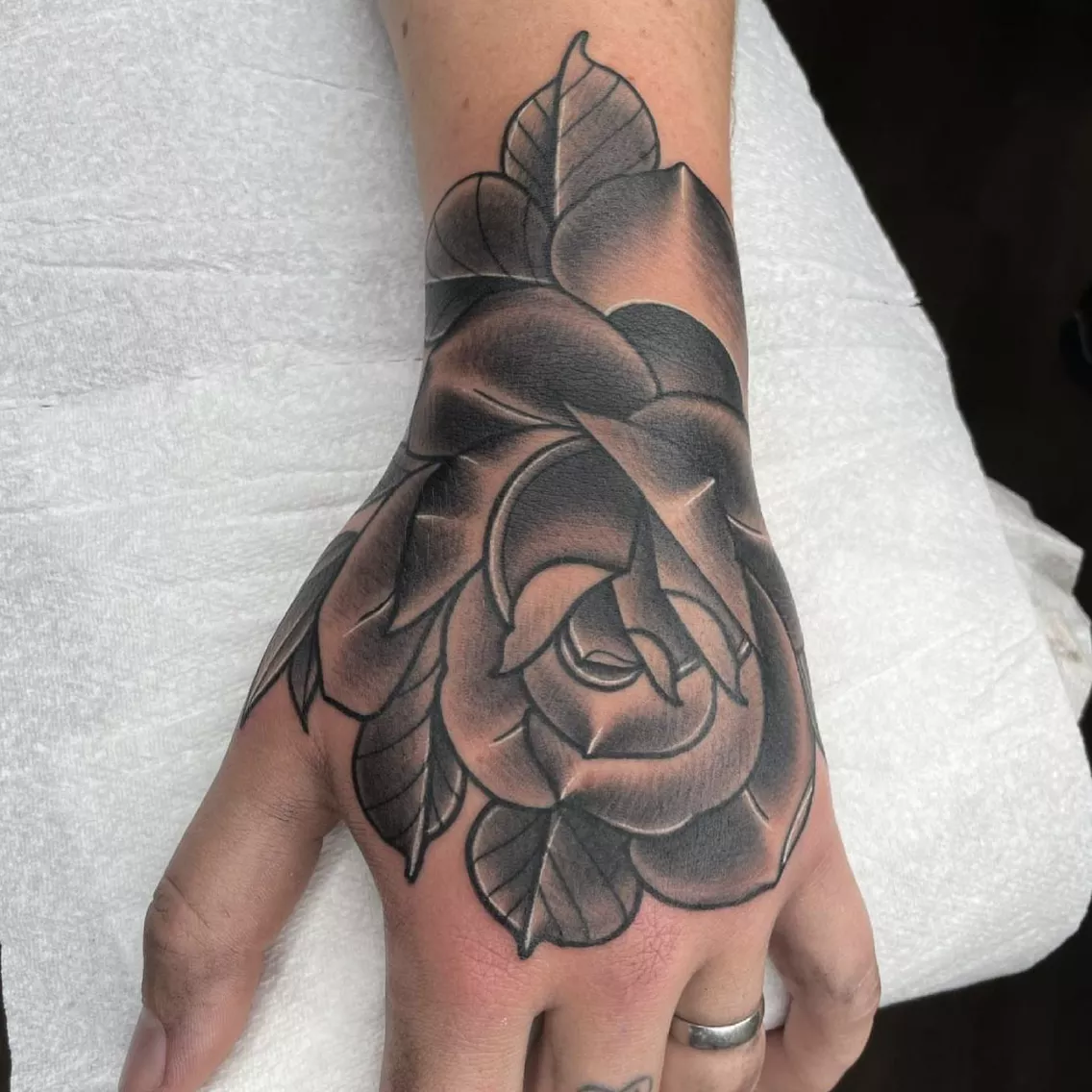 rose hand tattoo