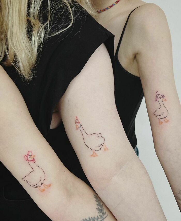 Elbow tattoos of three geesee