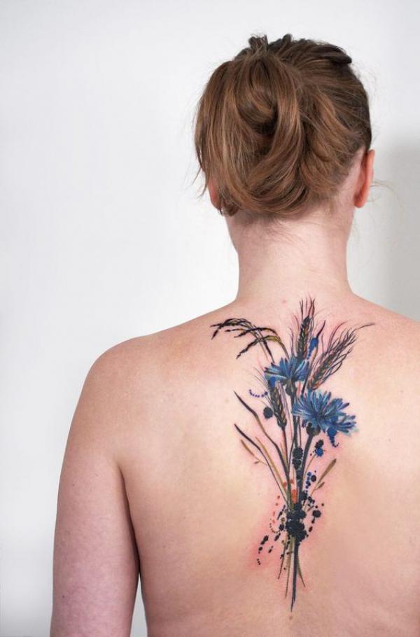 Cornflower and ears of wheat back tattoo
