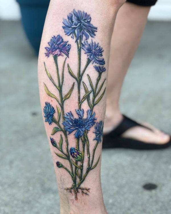 Cornflower lower leg tattoo