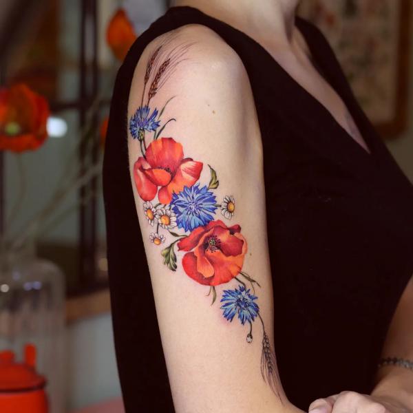 Cornflower poppy daisy and ears of wheat tattoo
