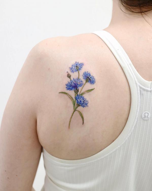 Cornflower shoulder blade tattoo