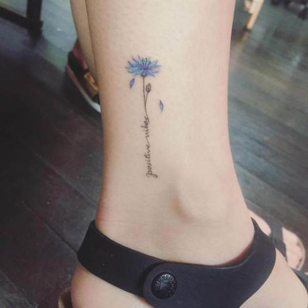 Tiny cornflower ankle tattoo