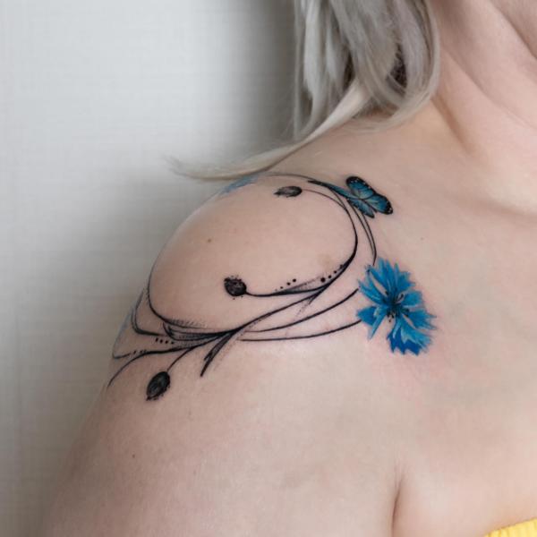 cornflower vine and butterfly shoulder tattoo